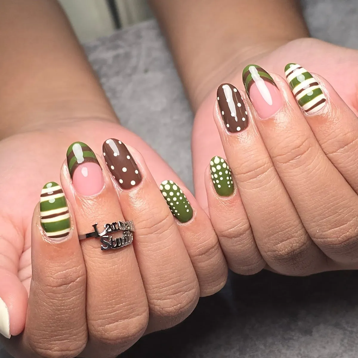 Green polka dots mixed with stripes and brown dots