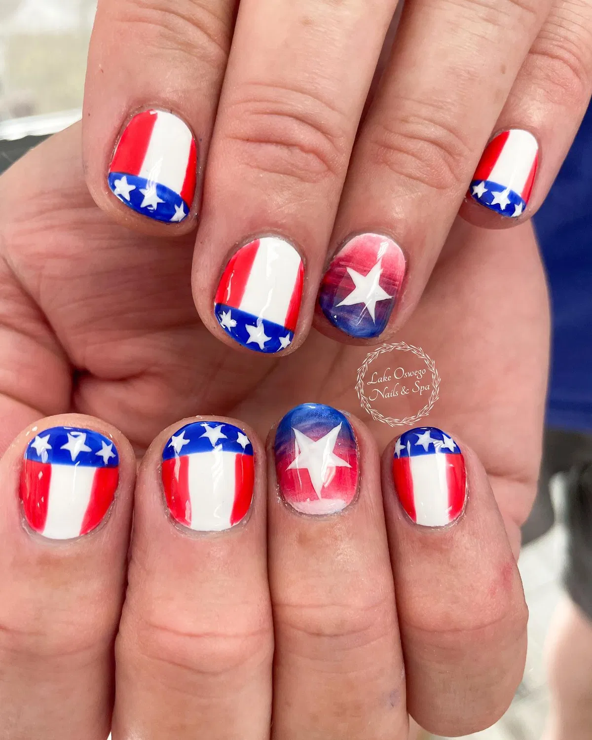 Vertical red/white blocks with blue star bands and large star accents