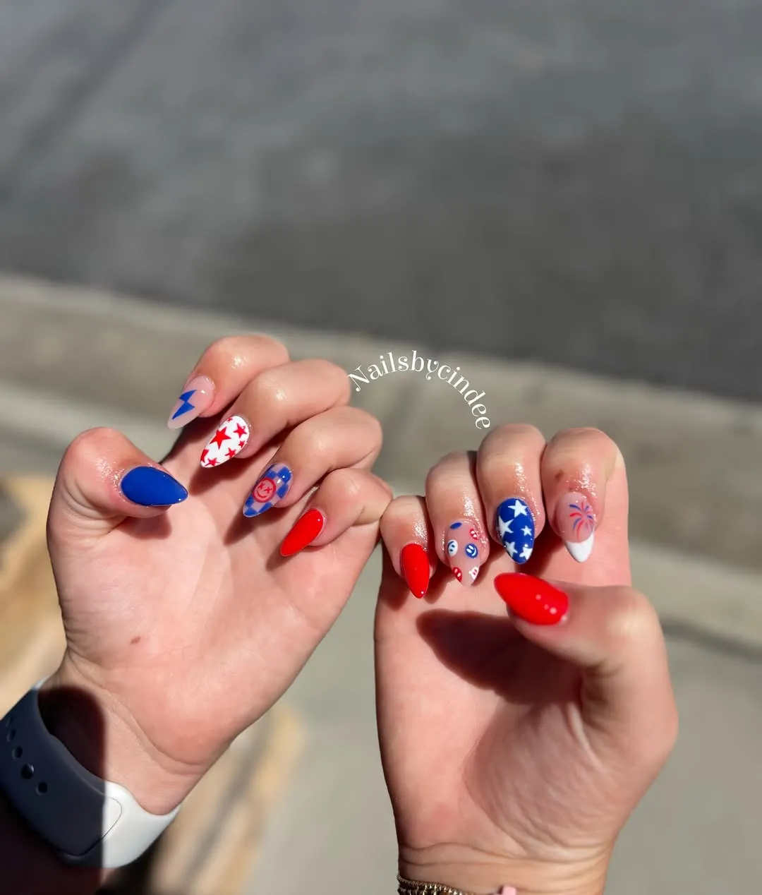 Red solids with star and firework-like accent nails