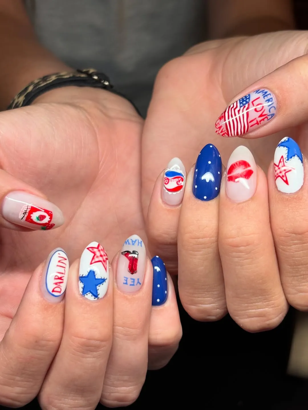Text nail with stripes plus lips, dots, and star outlines