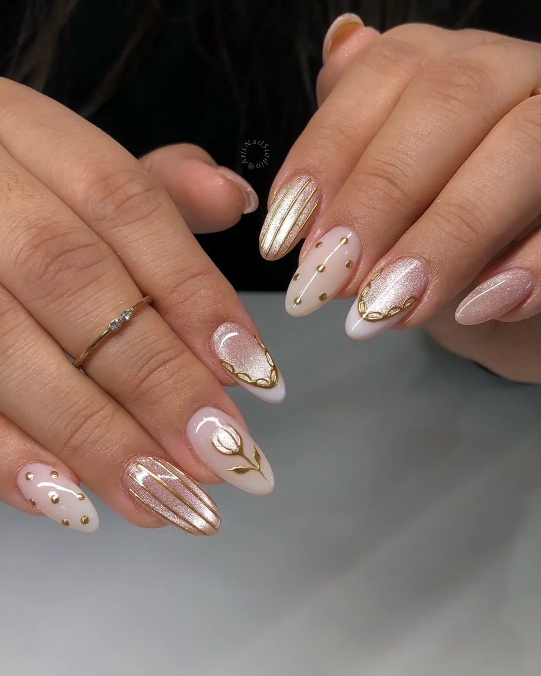 Pale shimmer with gold striping and studs