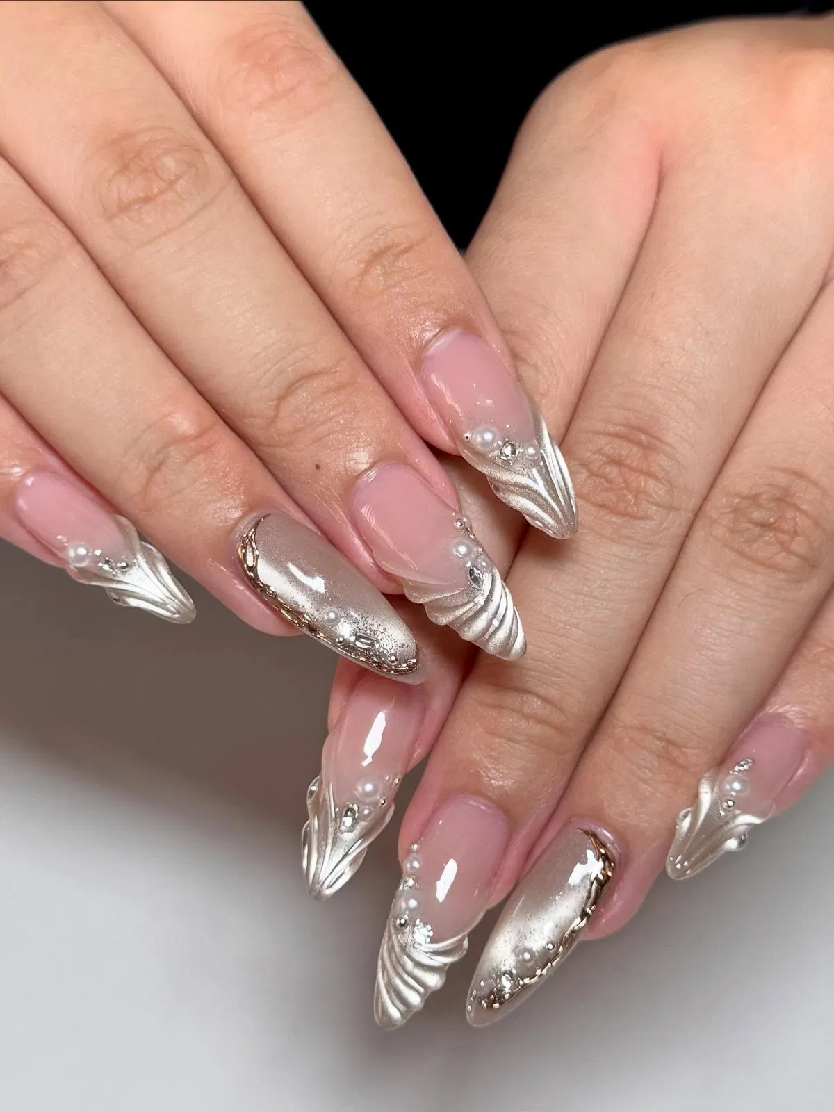 Sculpted silver swirls with pearls and crystals