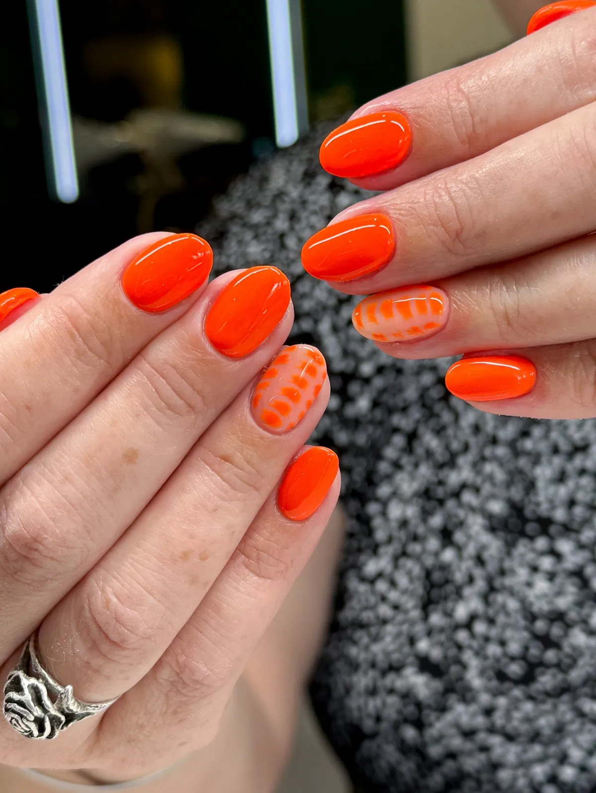 Bright orange solids with nude-and-orange abstract accents