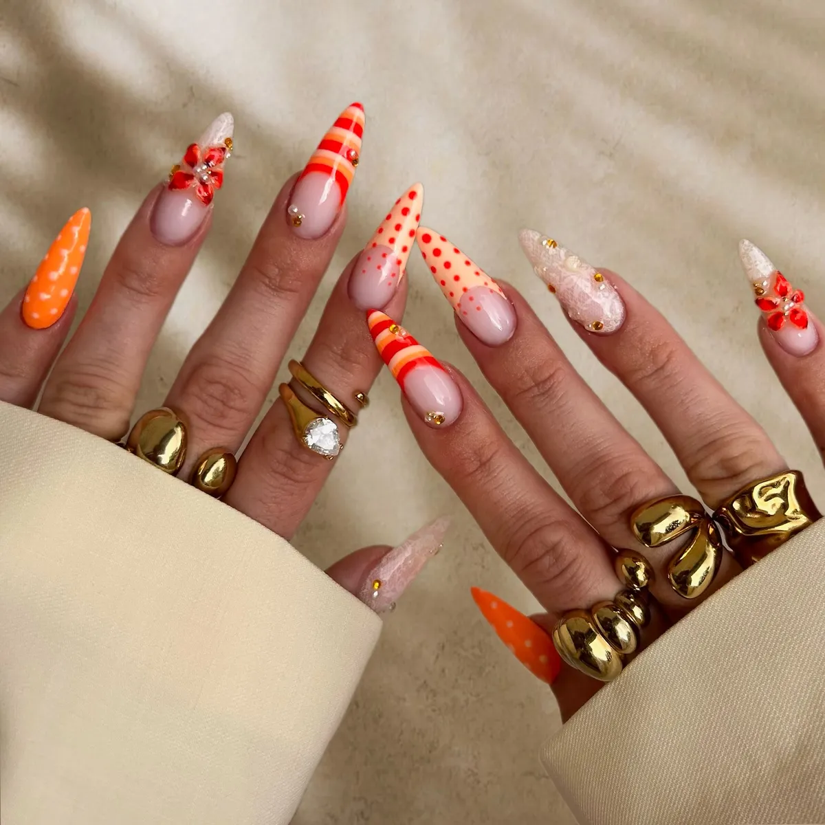 Long pointed orange mix: stripes, dots, and 3D florals