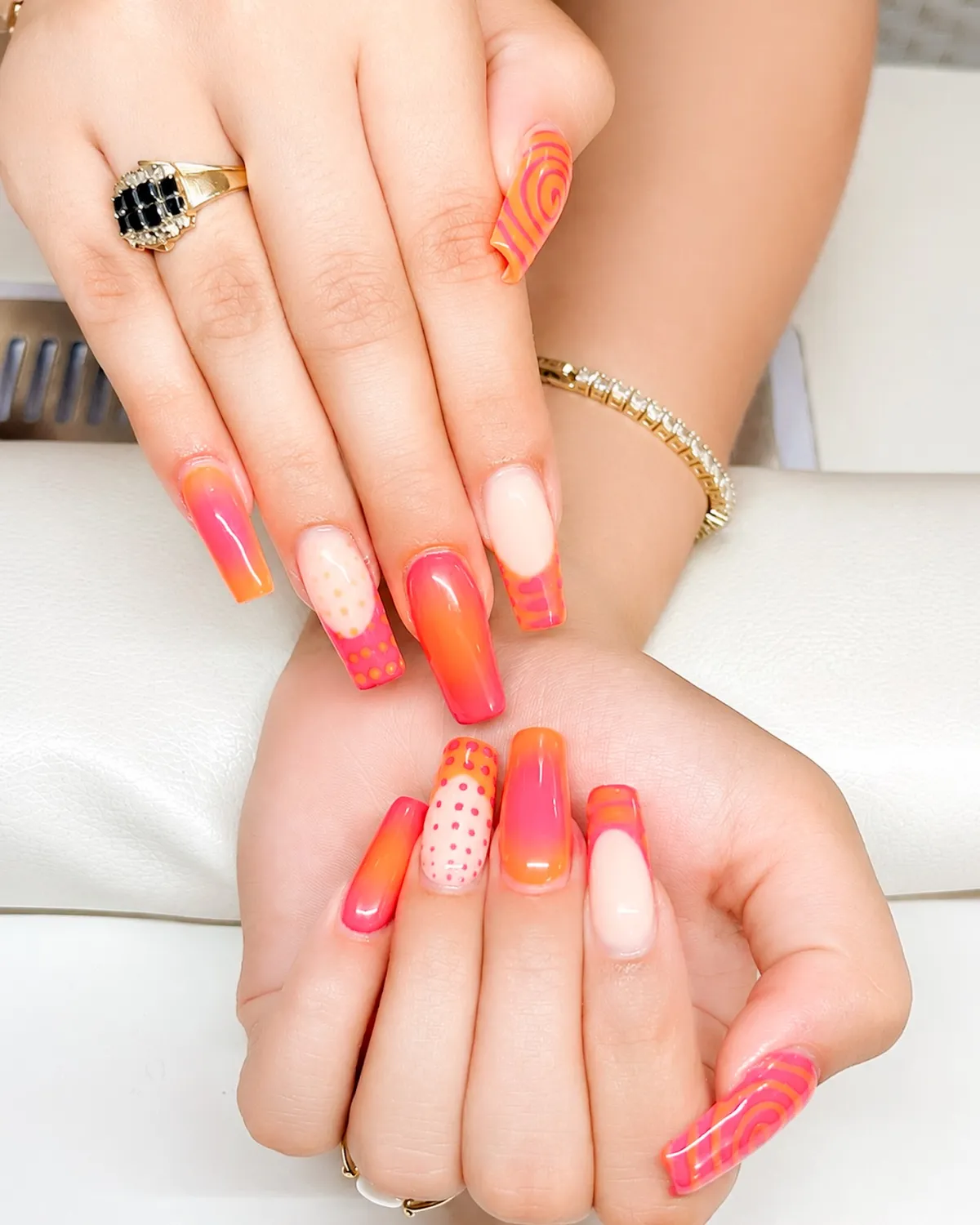 Pink-orange gradients with swirls and polka dot accents