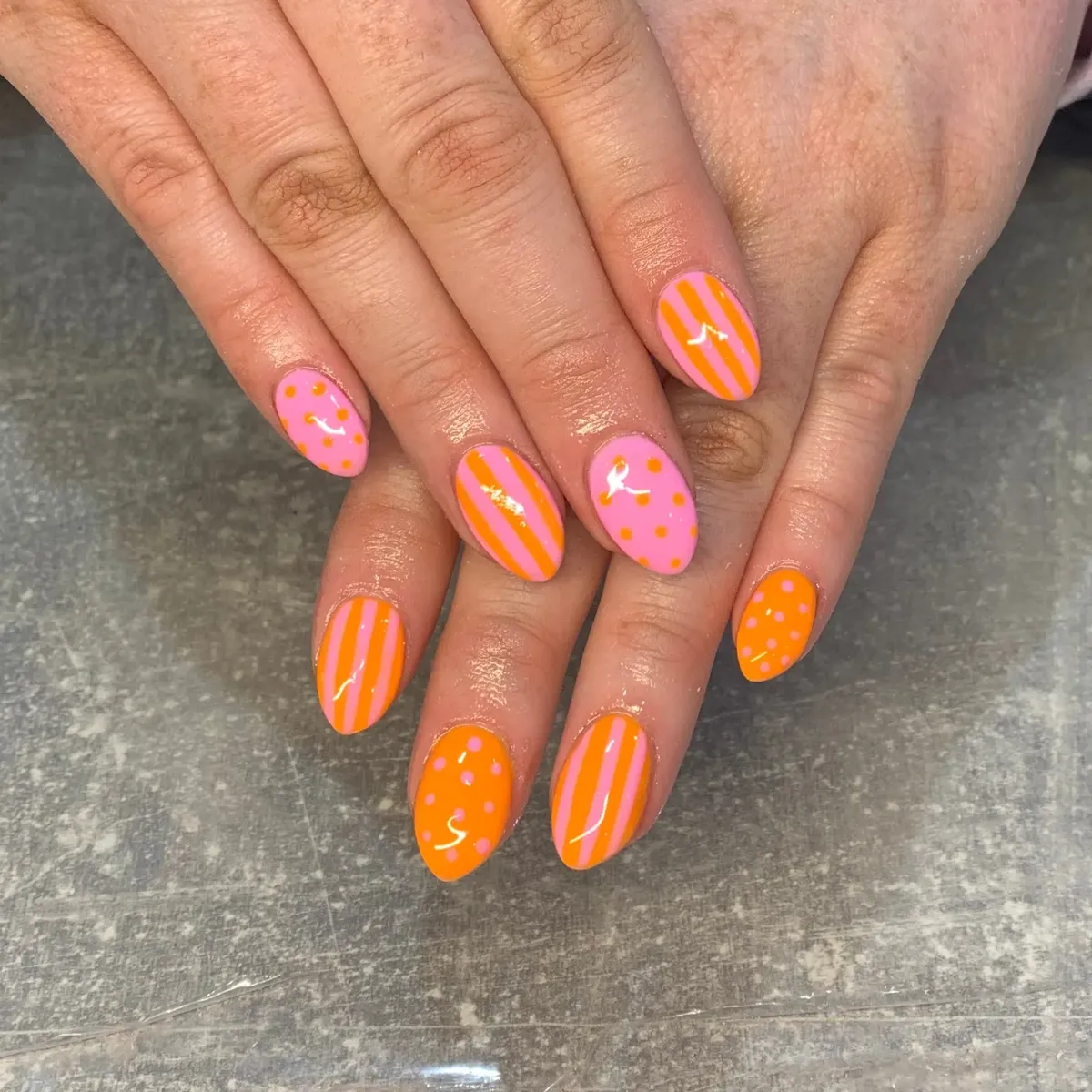 Pink-and-orange graphic mix with stripes and dots