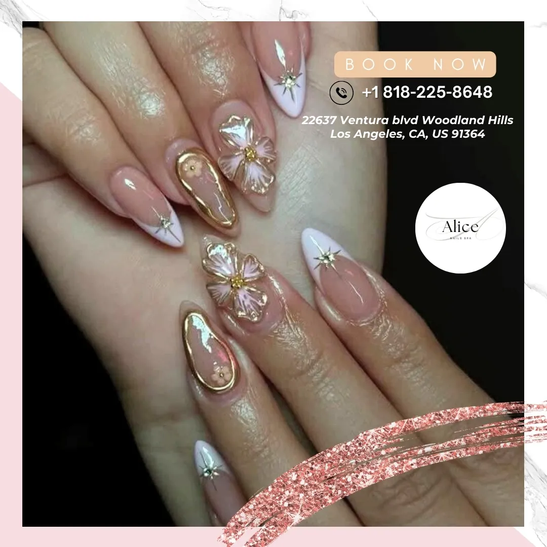 Long nude nails with V-French tips, starbursts, and 3D flowers