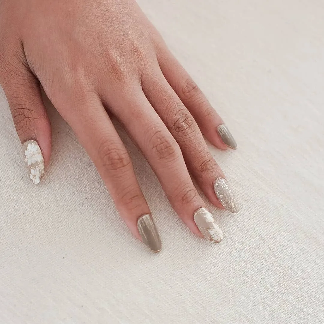 Metallic silver and floral-accent almond nails