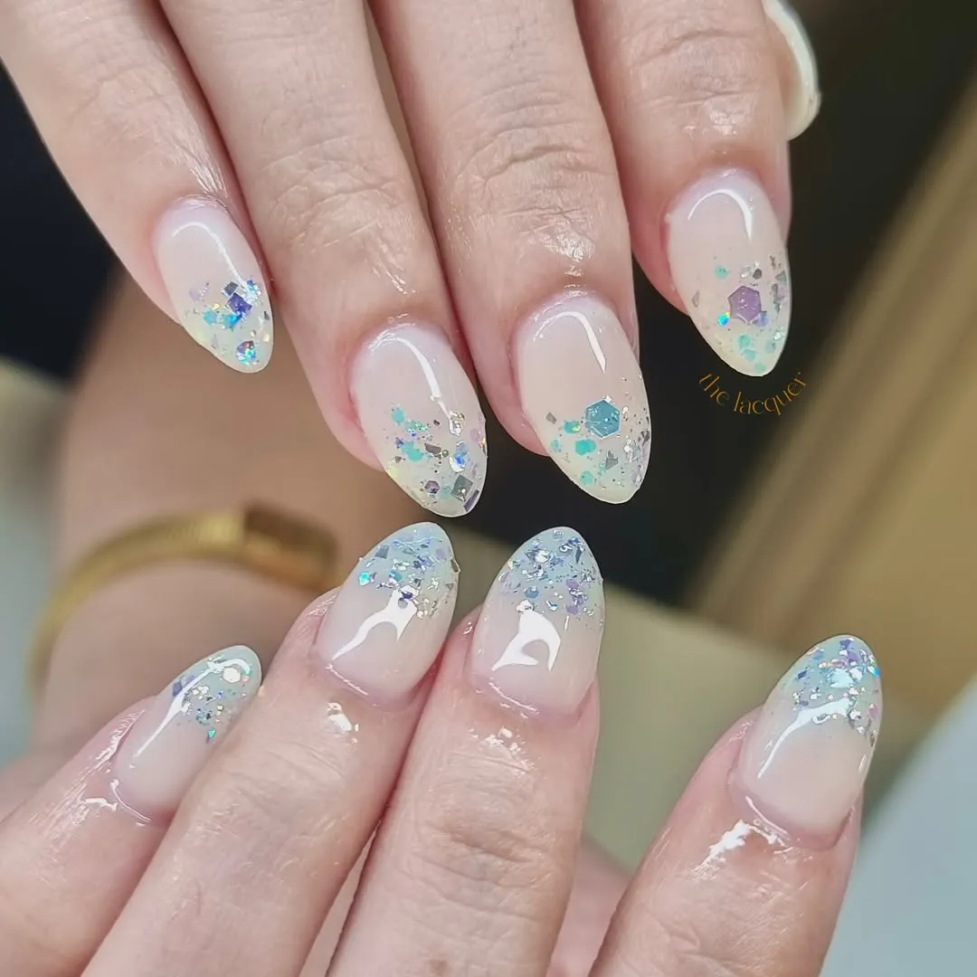 Nude-to-tip iridescent confetti glitter gradient