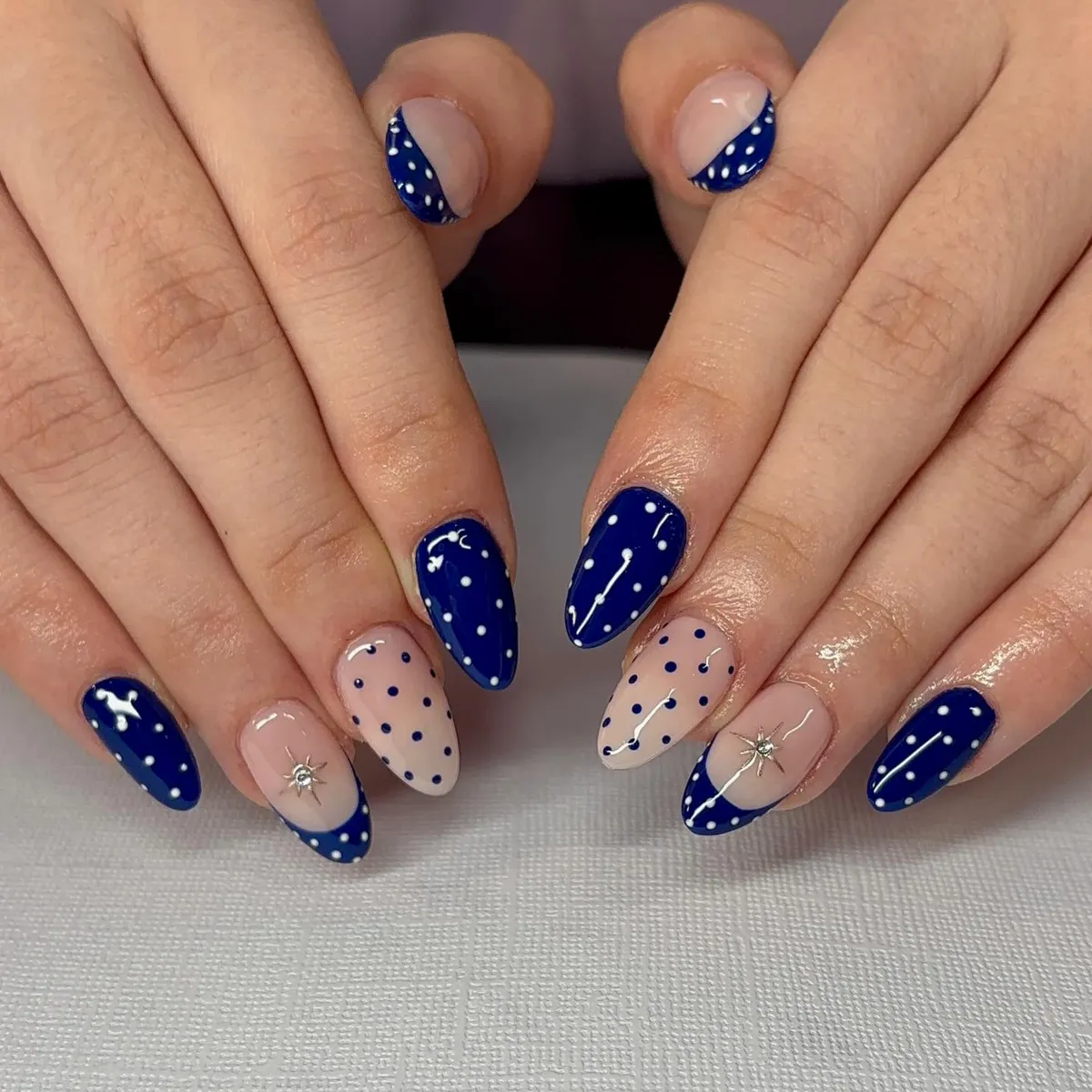 Almond navy-and-nude polka dots with starburst accents