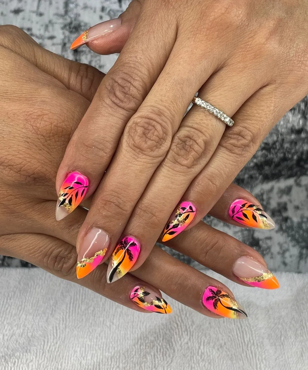 Sunset gradient with black palm silhouettes and gold accents
