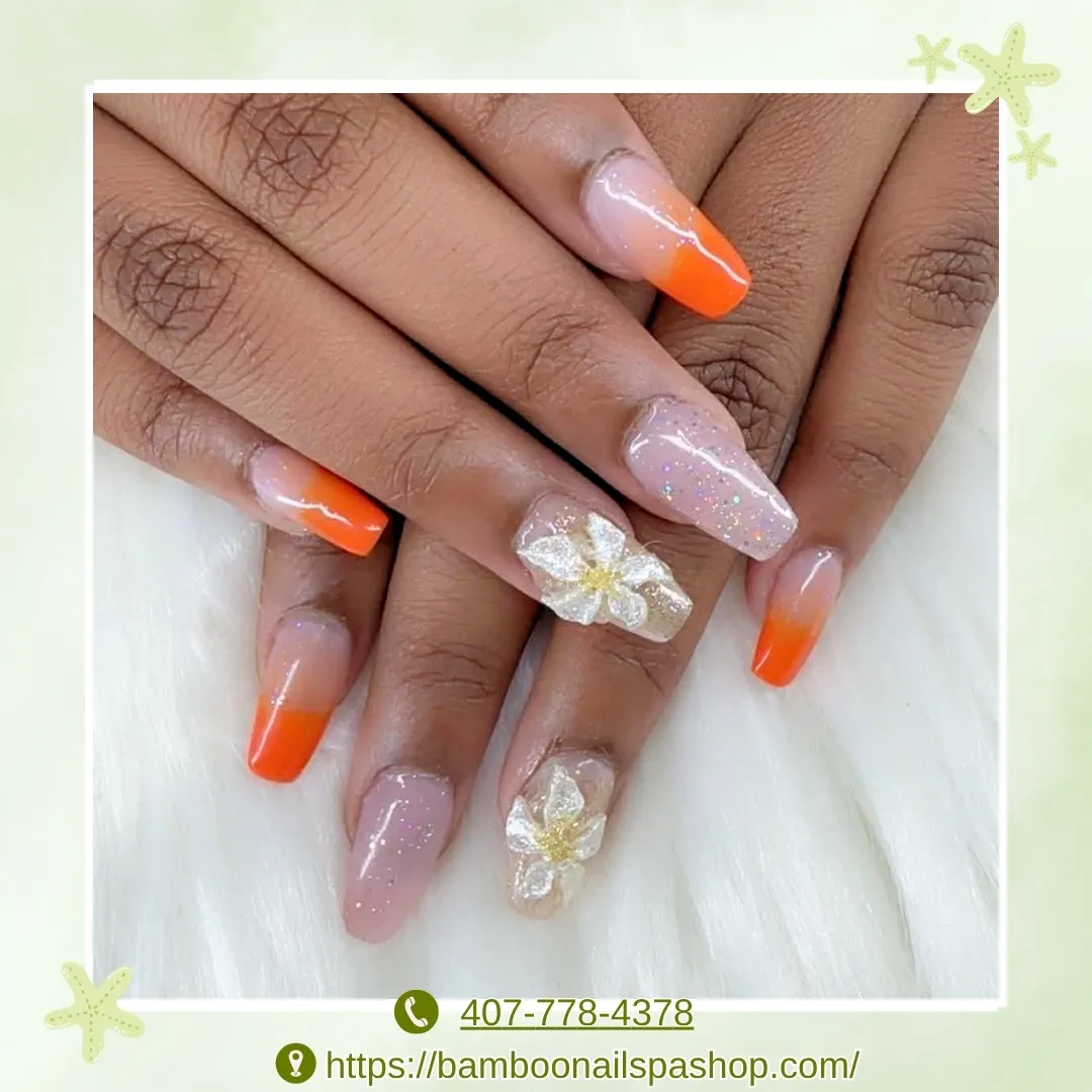 Orange ombrรฉ tips with 3D white flowers