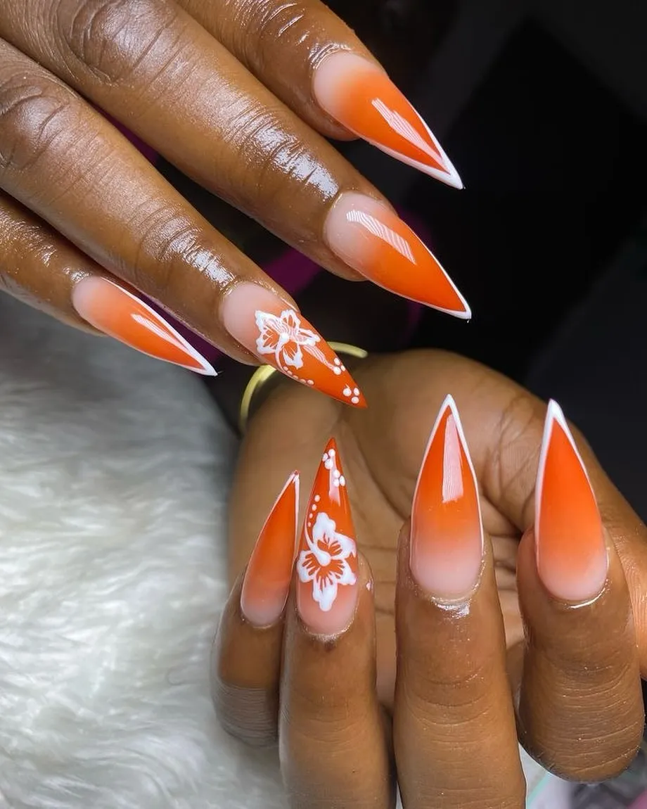 Orange ombrรฉ stilettos with white florals