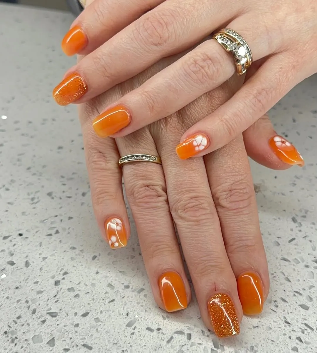 Solid orange set with glitter accent and white flowers