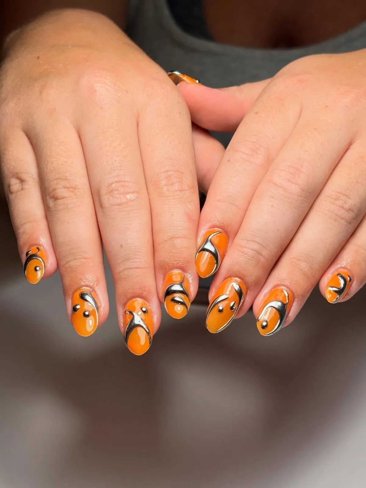 Orange Base with Black-and-Silver Swirls and Bead Accents