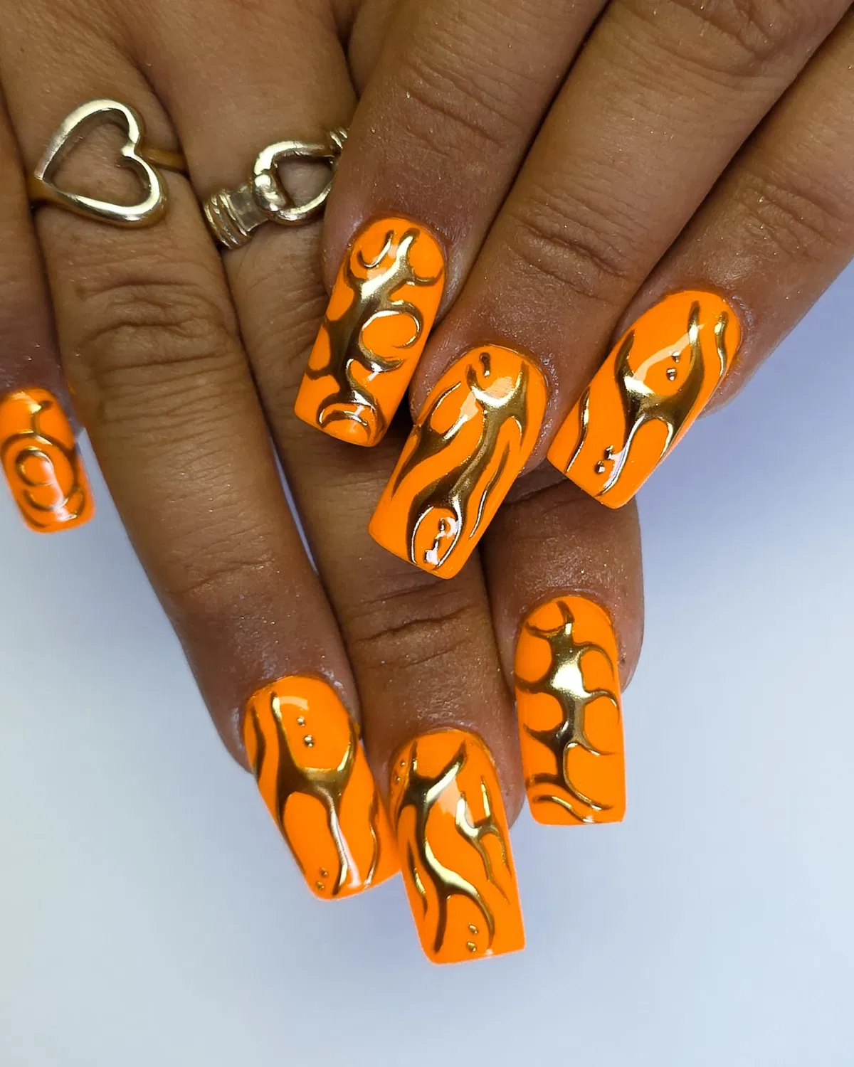 Glossy orange squares with raised gold metallic abstract art