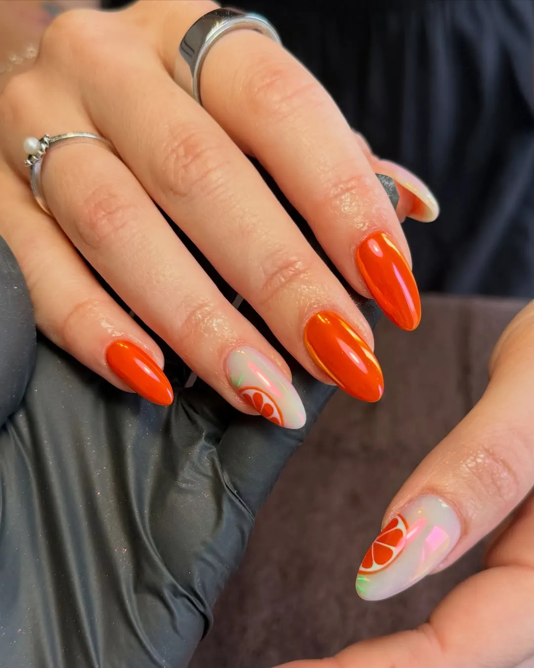 Glossy bright orange with citrus-slice accent nails