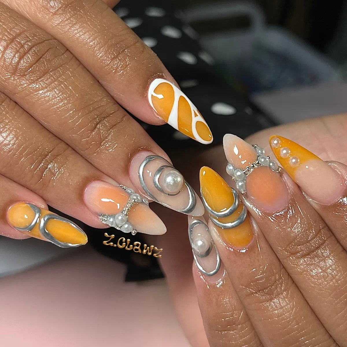 Orange and nude with silver metallic outlines and pearls