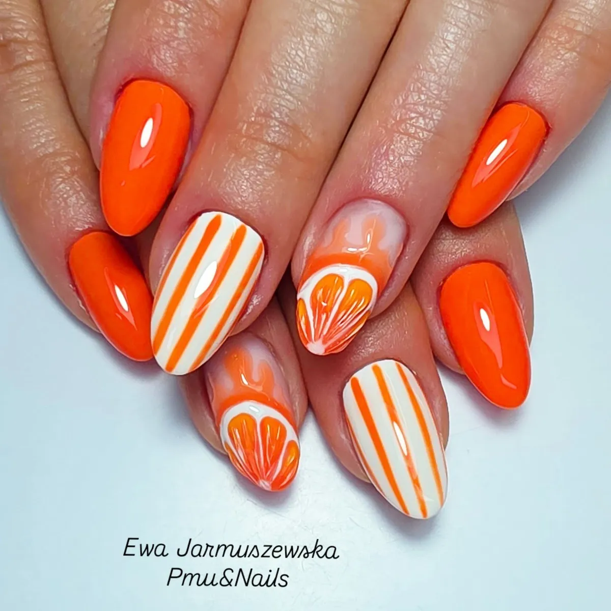 Bright orange set with striped and orange-slice accent nails