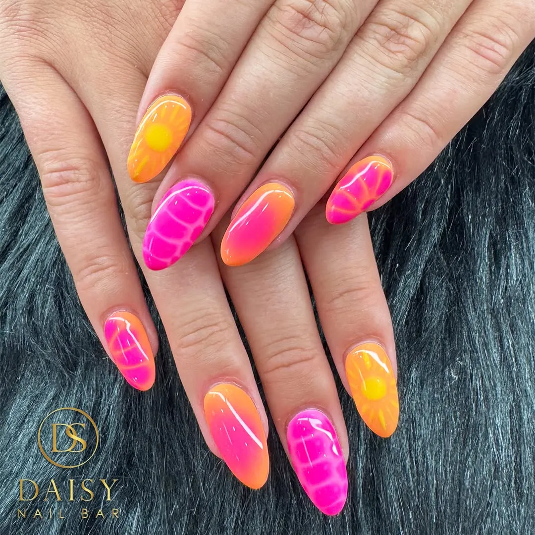 Neon orange-to-pink ombre with sun motifs and bright patterned accents