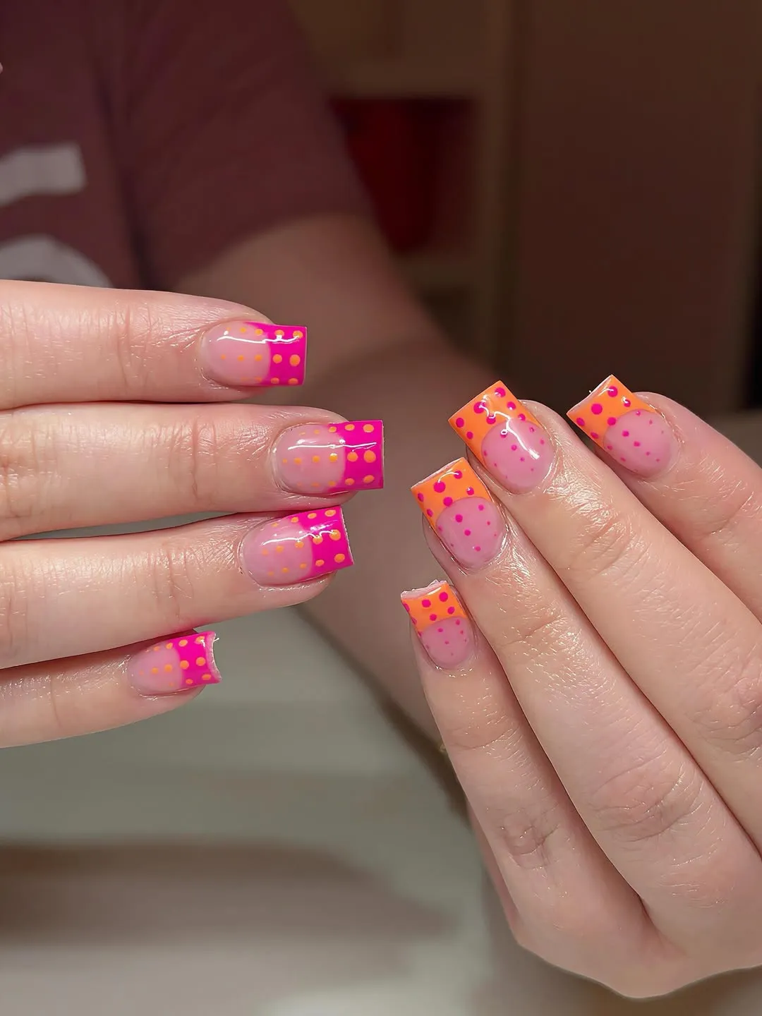 Pink-and-orange French tips with polka dots