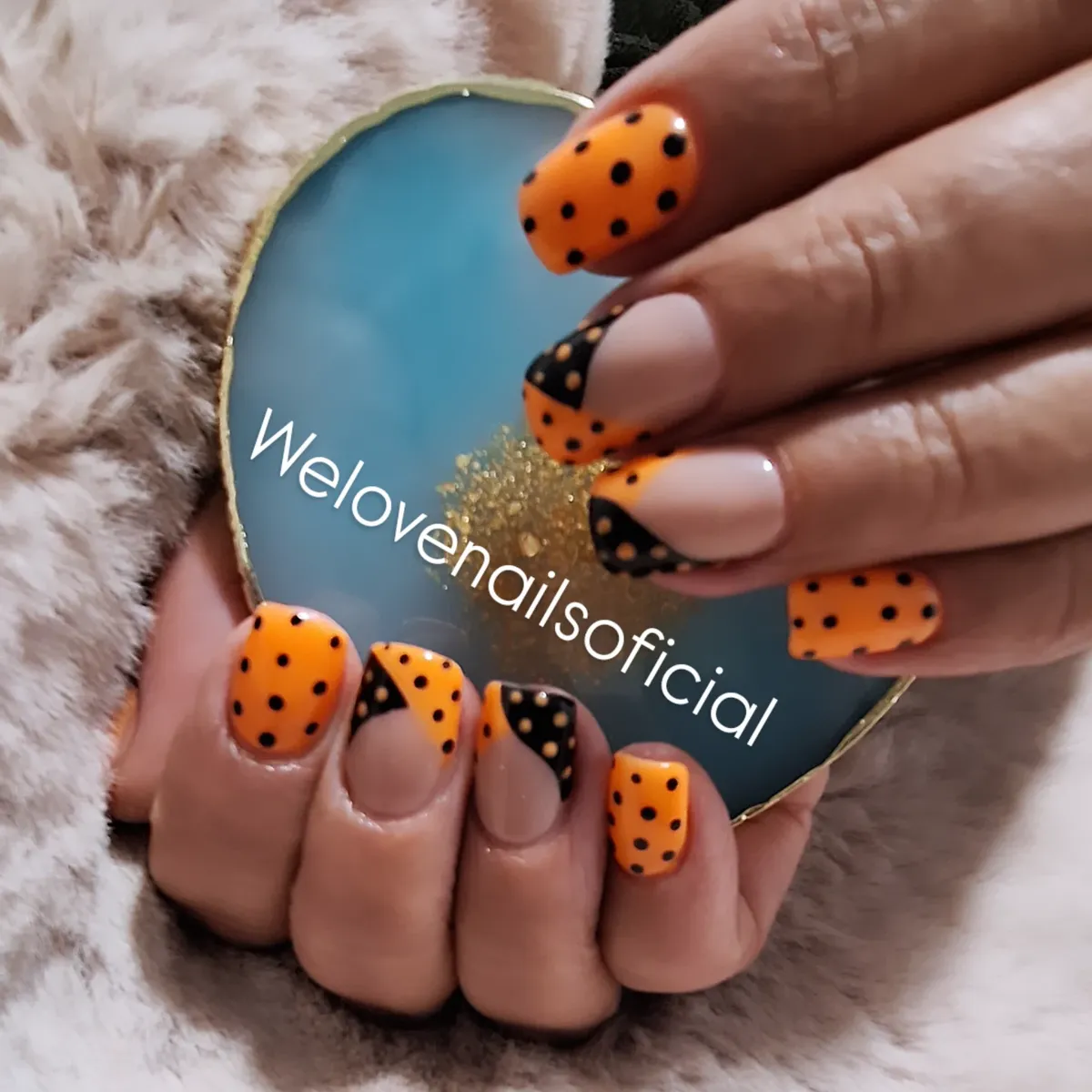 Orange-and-black polka dots with diagonal color-block accents