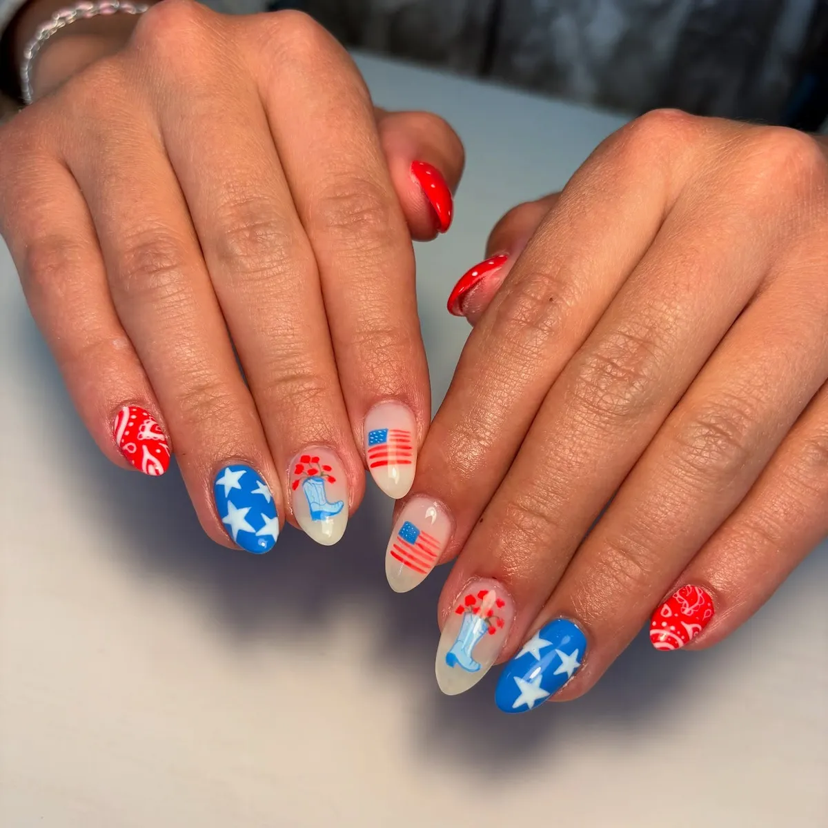 Star nails with bandana print and illustrated accents