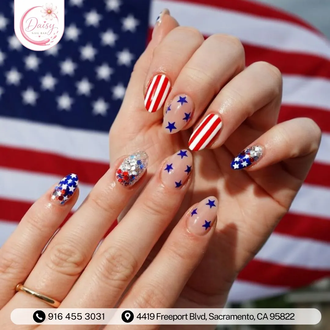 Striped and star nails with glitter confetti accents