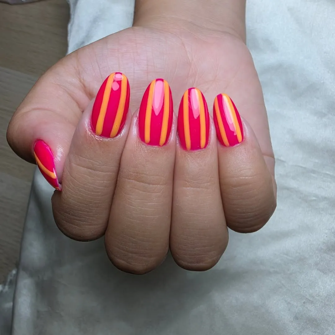 Hot Pink Nails with Vertical Orange Stripes