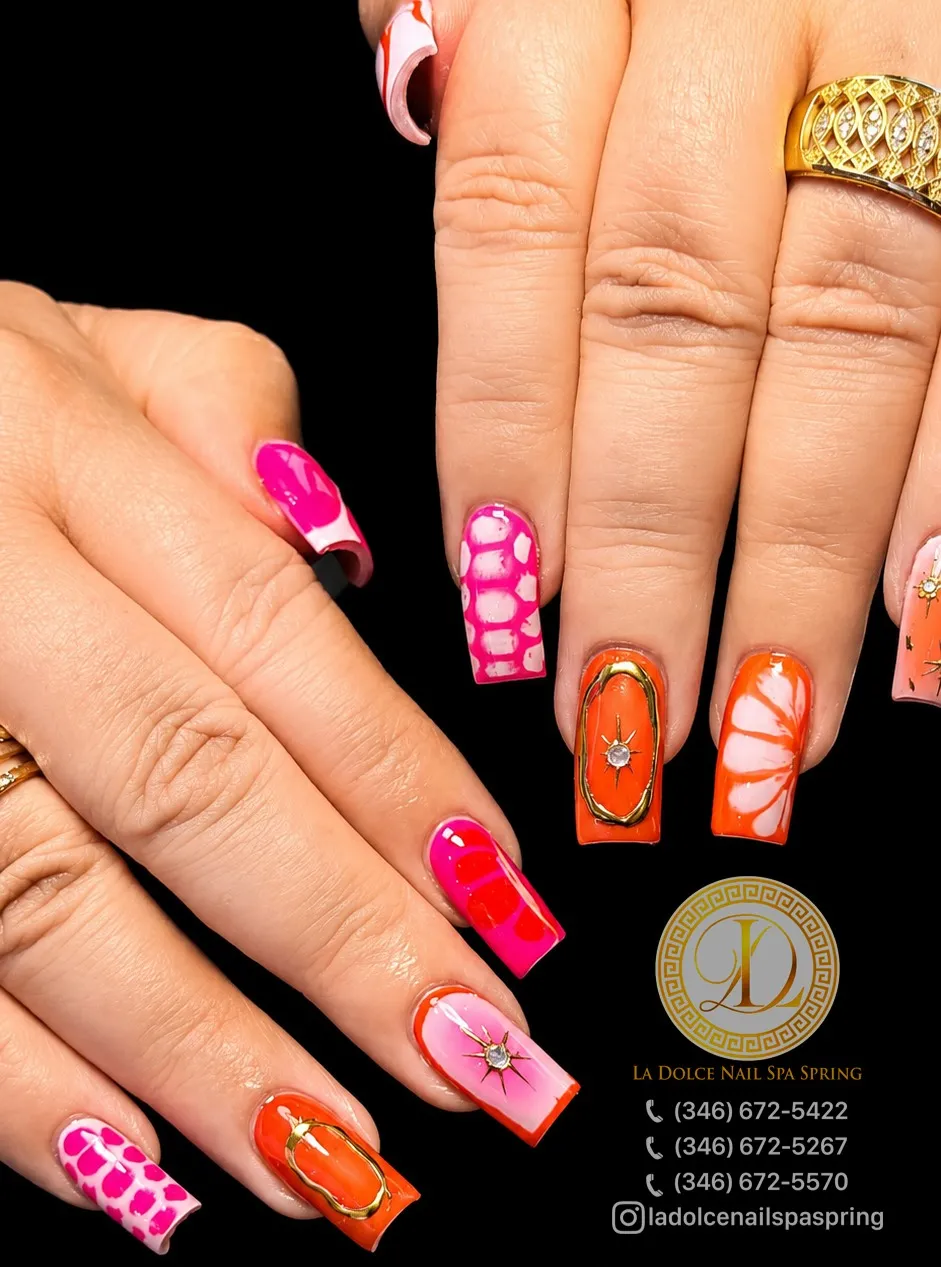 Bold pink-orange set with gold starbursts and white swirls