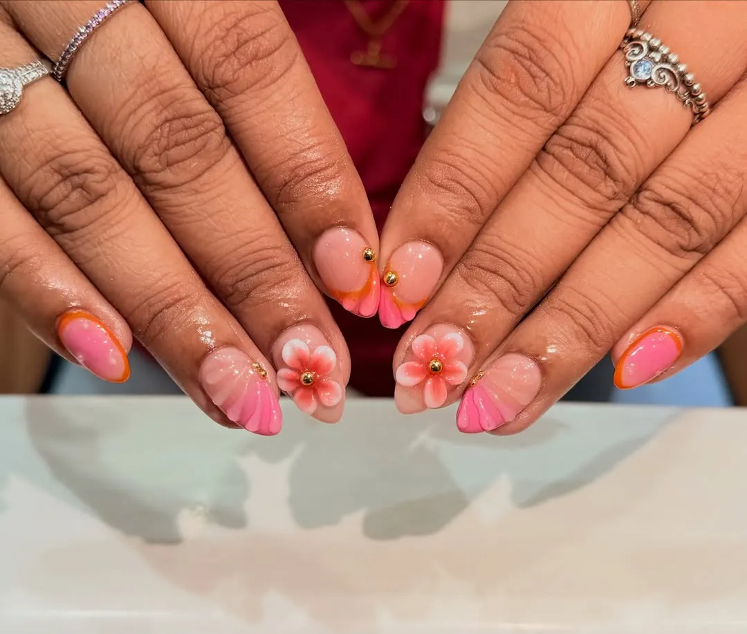 Pink-orange floral accents with gold beads