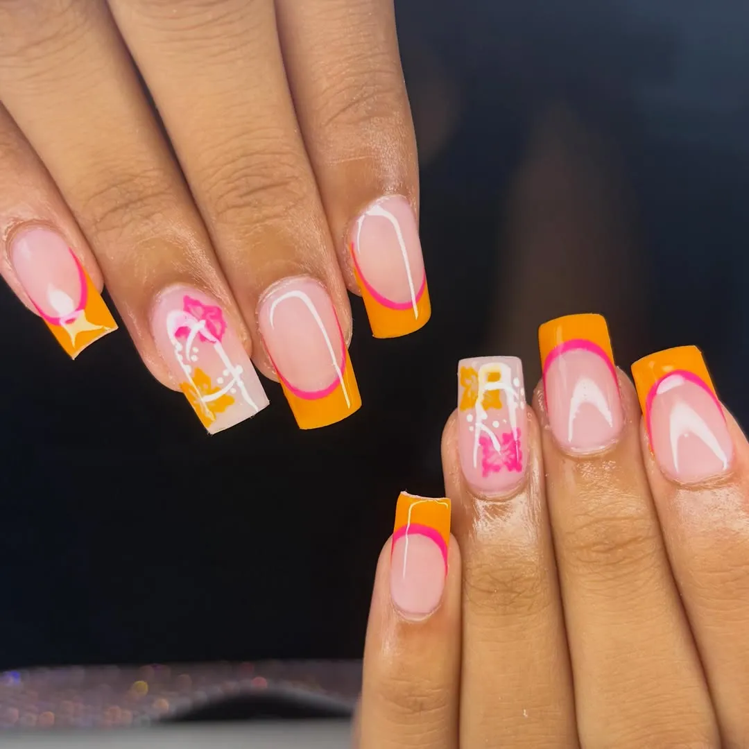 Square orange French tips with pink outline and floral accents