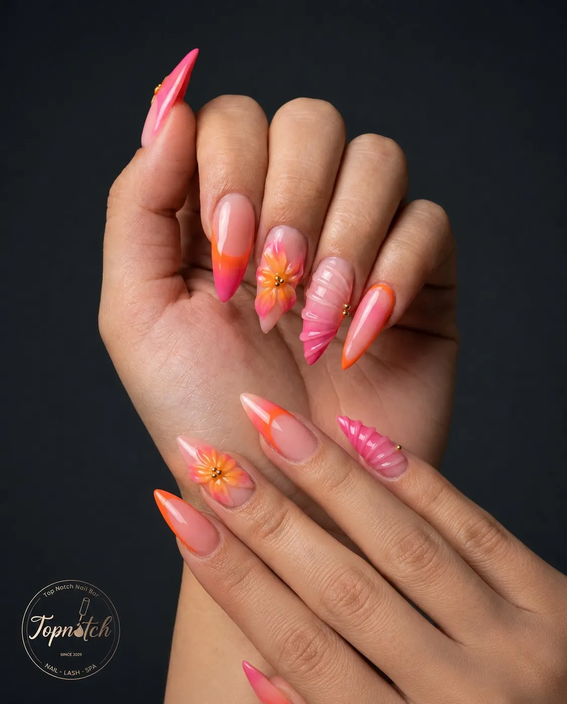 Stiletto ombré tips with 3D flowers and ribbed texture accents