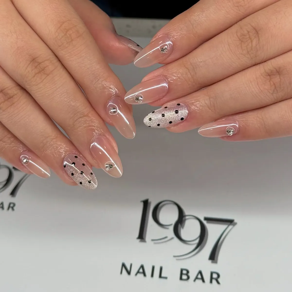 Nude Glossy Nails with Dotted Silver Accent and Rhinestones