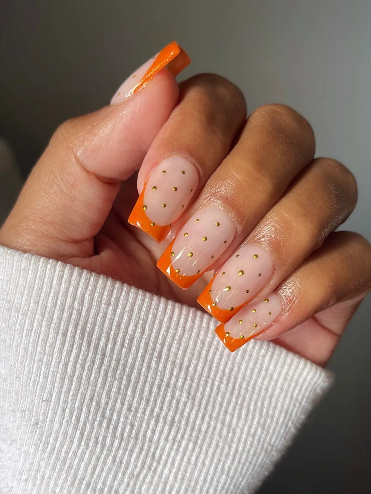 Orange French Tips with Scattered Gold Dots