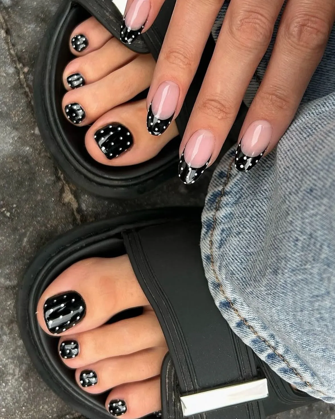 Black polka-dot French tips paired with matching polka-dot pedicure