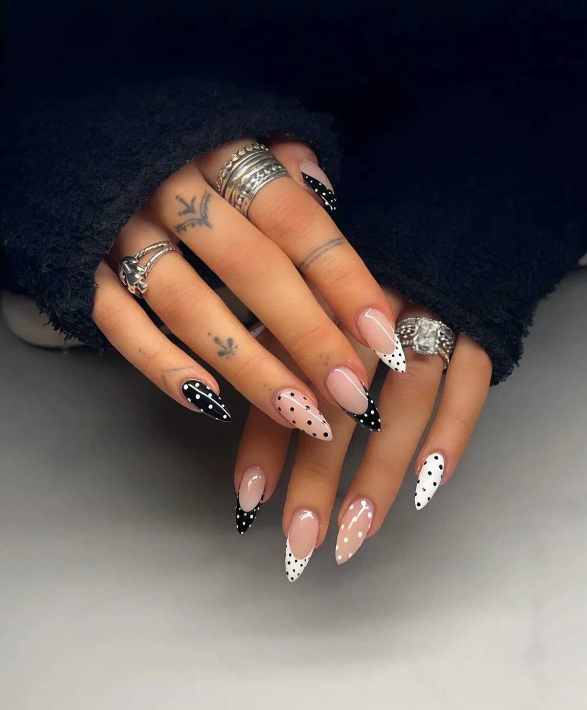 Black-and-white polka dot French tips with mixed accent nails