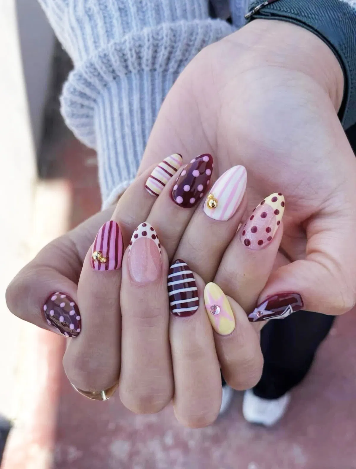 Mixed stripes and polka dots with gold-toned studs