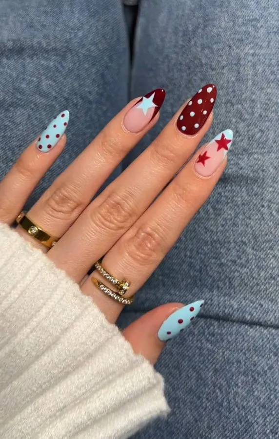 Light blue polka dots with star accent nails