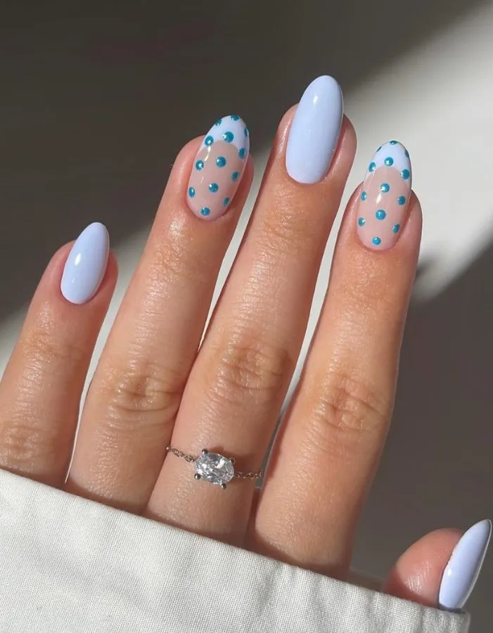 Light blue solids with teal polka dot accent nails