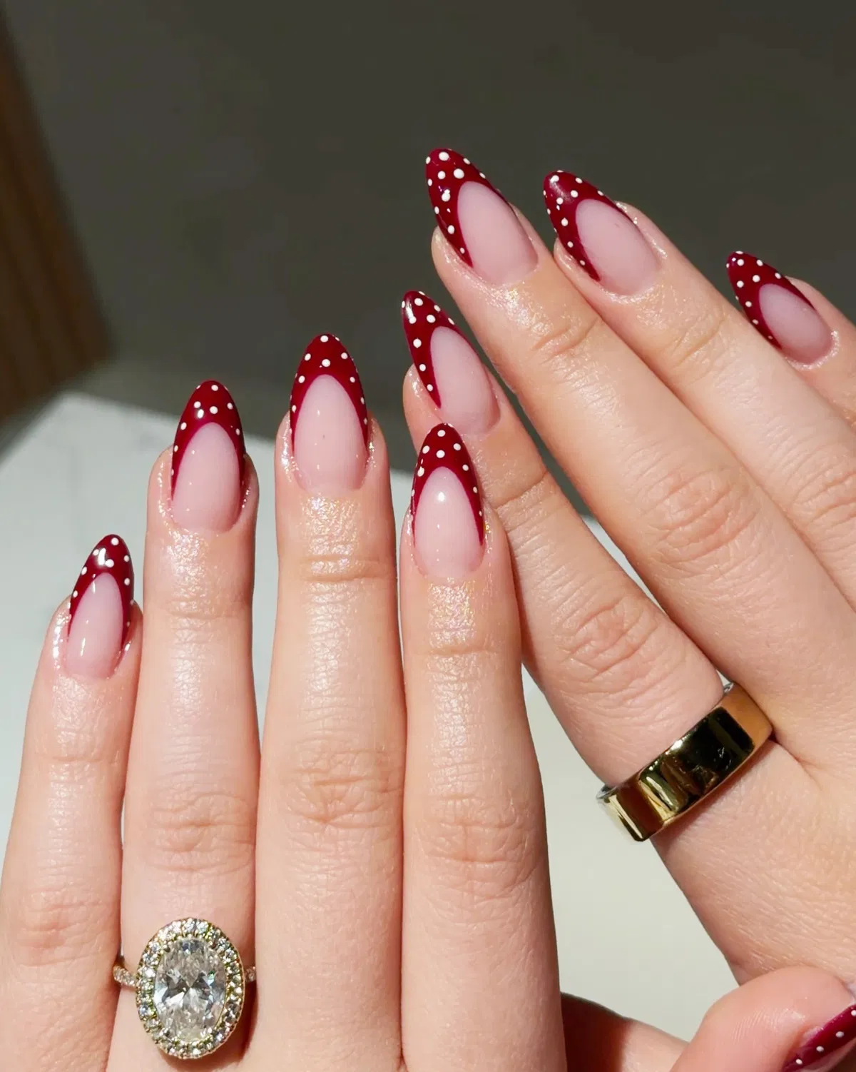 Deep red polka-dot French outline tips