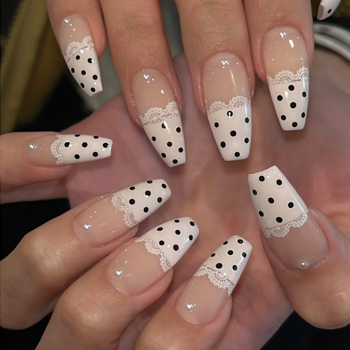 Coffin nails with lace-edged dotted white tips