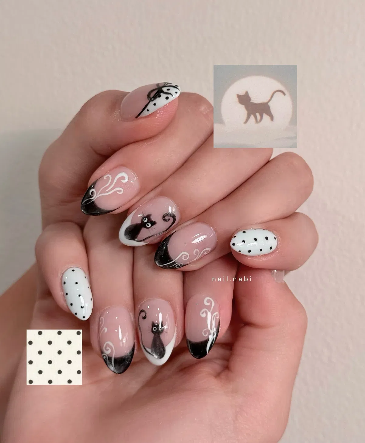 Cat silhouettes with dotted accents and black French tips