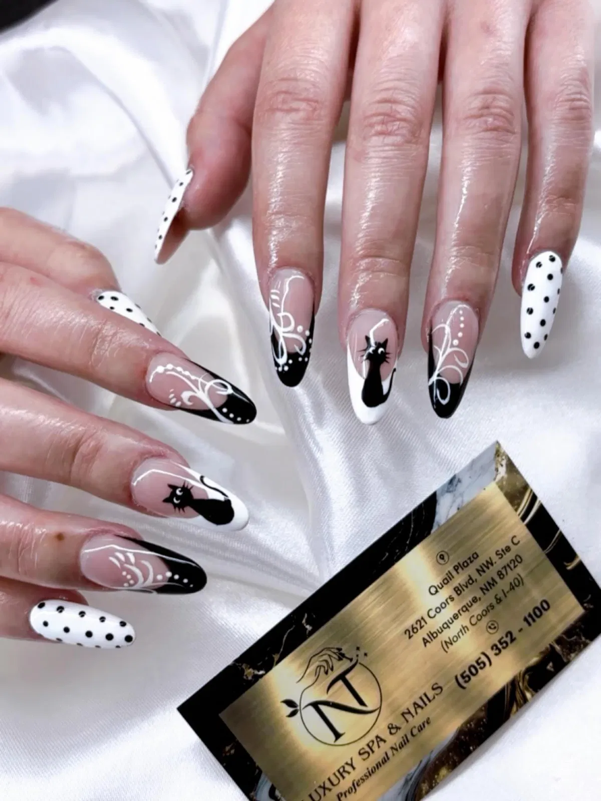 Graphic French tips with polka dots and cat silhouettes