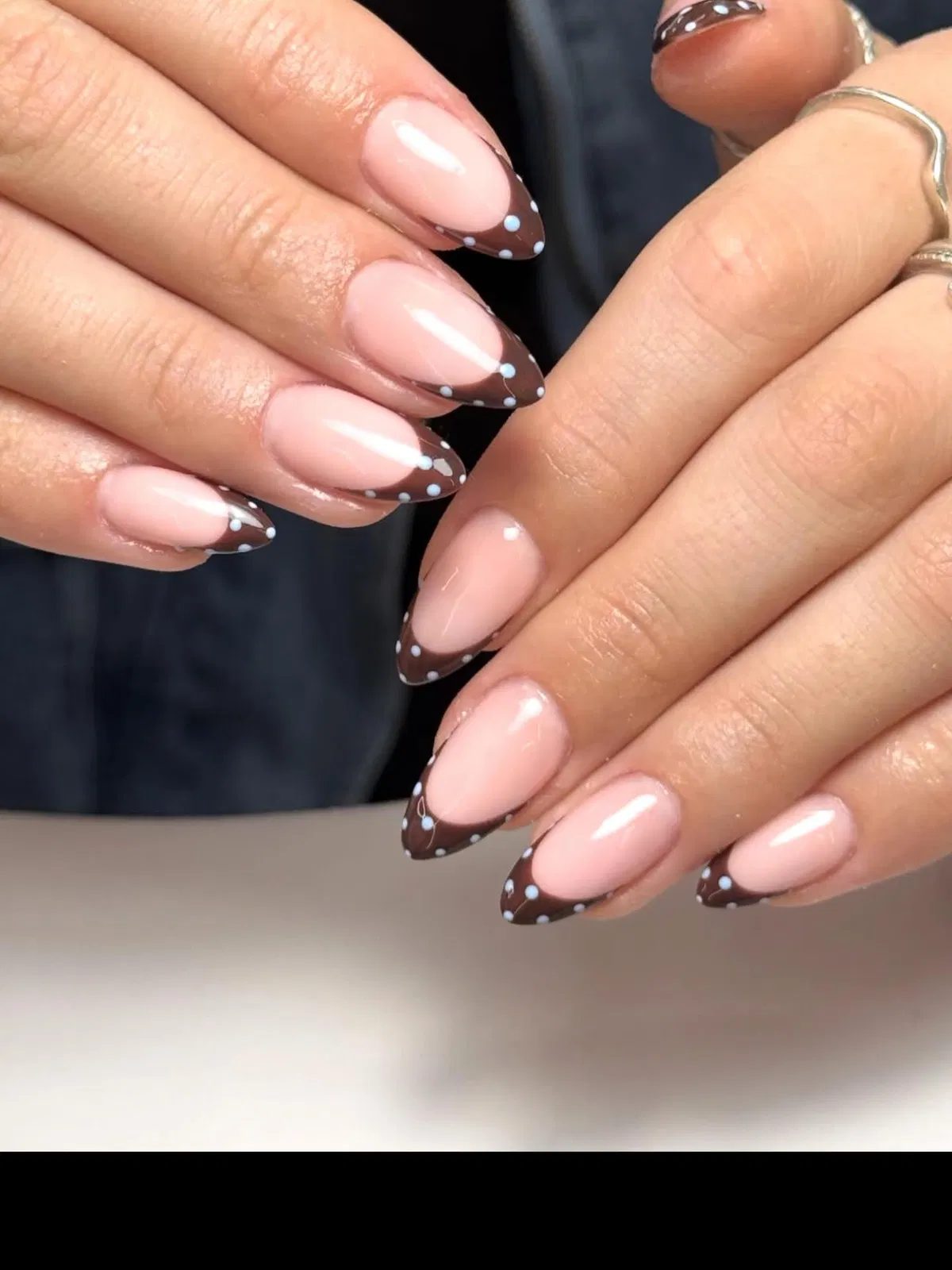 Brown French tips with light-blue polka dots