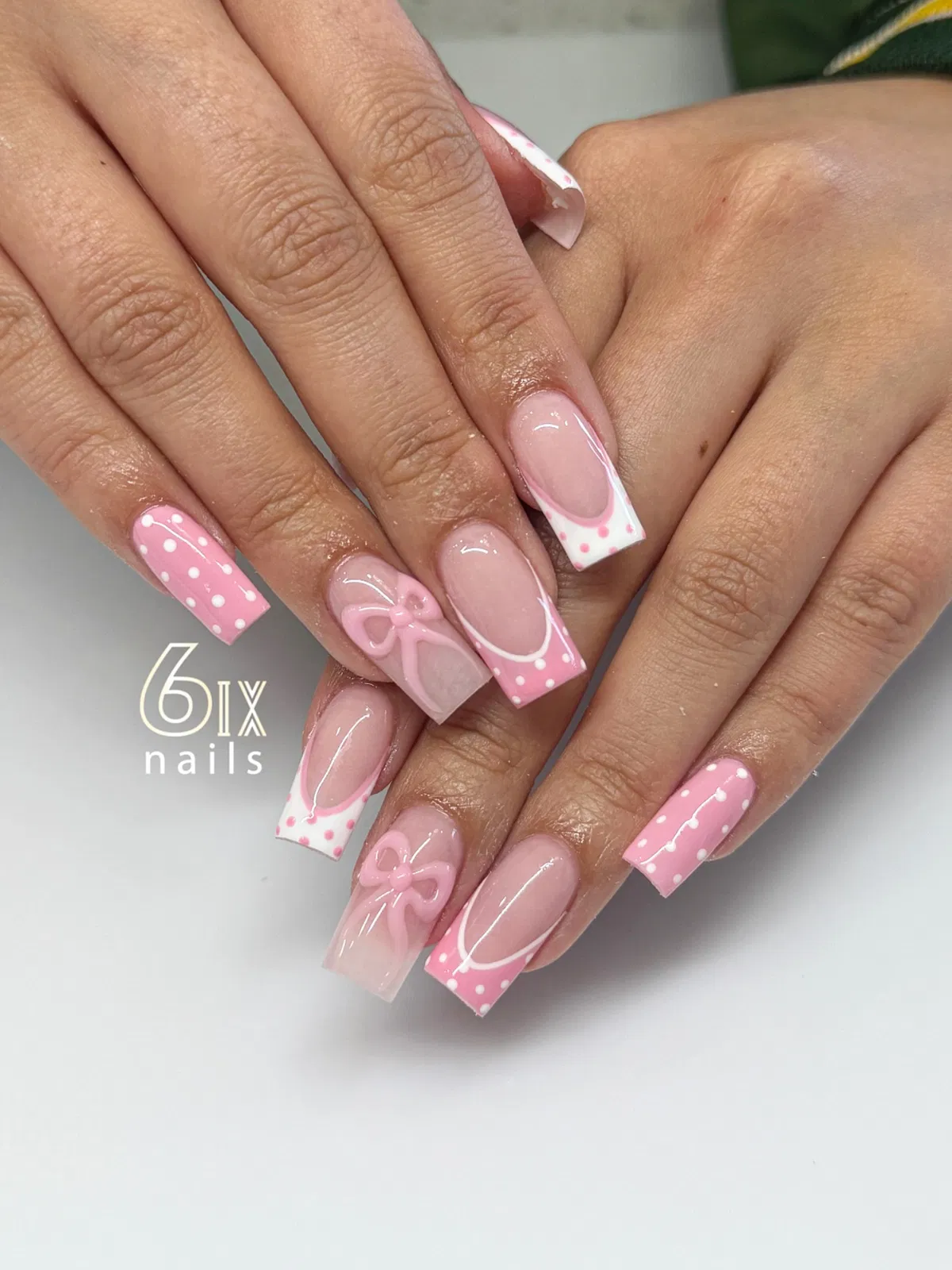 Pink polka-dot tips with bow accents
