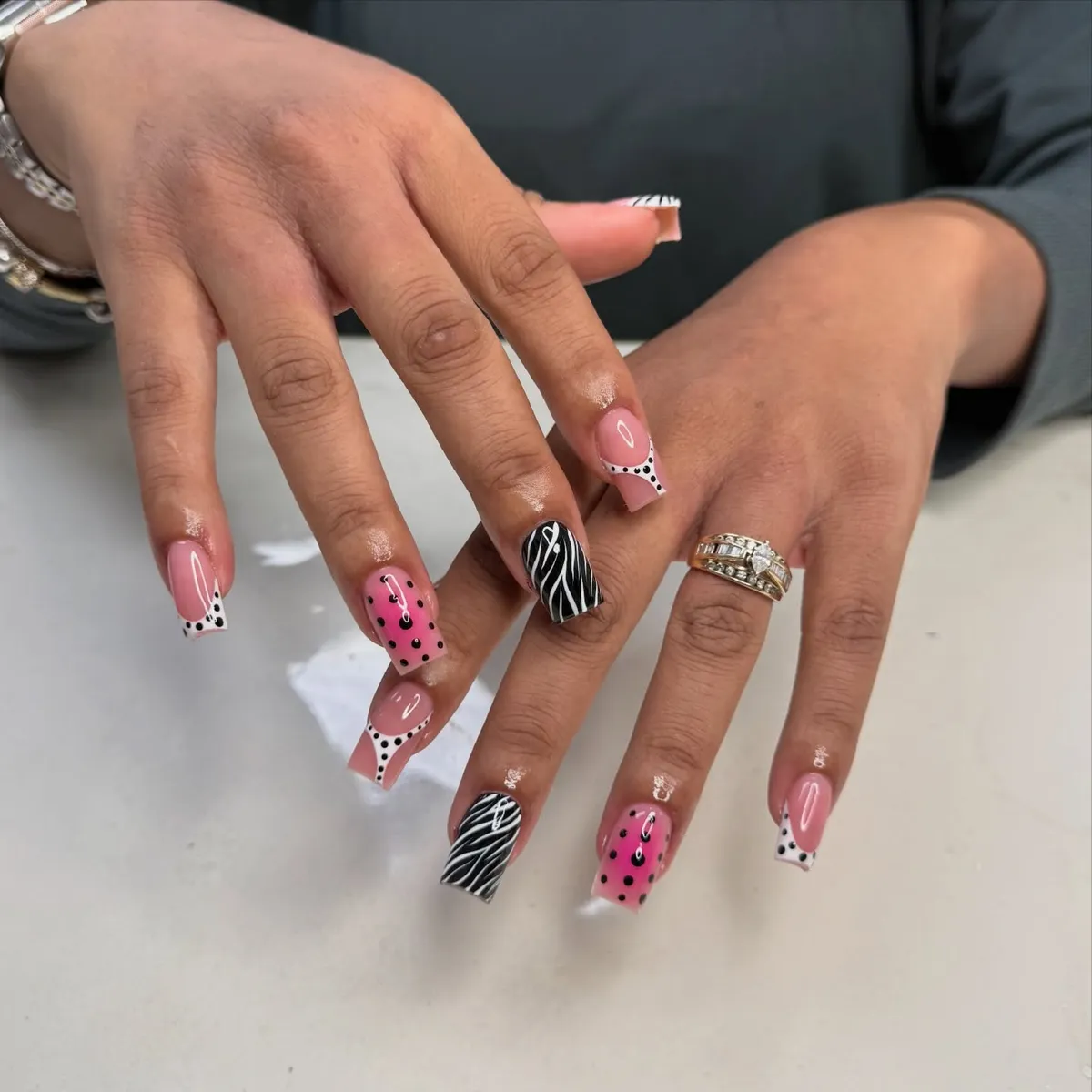 Pink polka dots with zebra accent nails