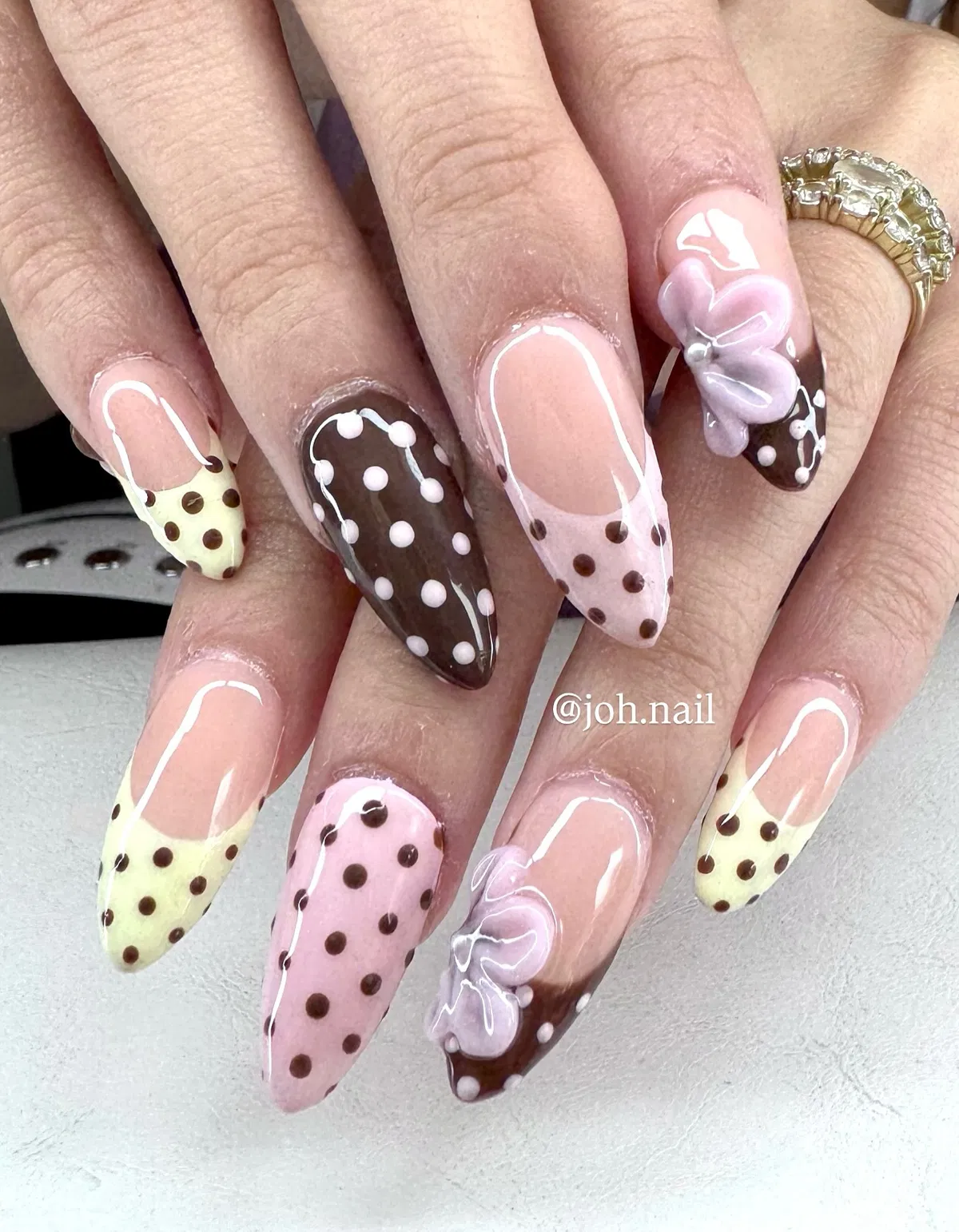 Neutral polka dots with brown accents and lavender floral details