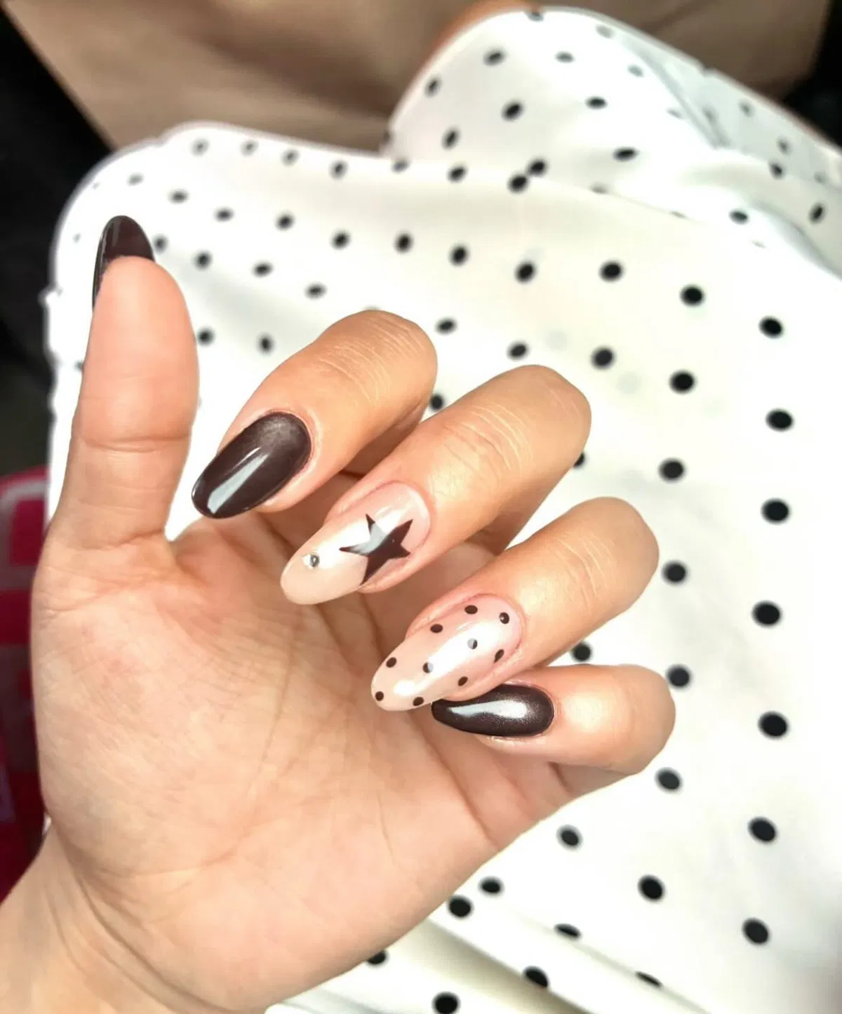 Dark solids with nude polka-dot and star accent nails