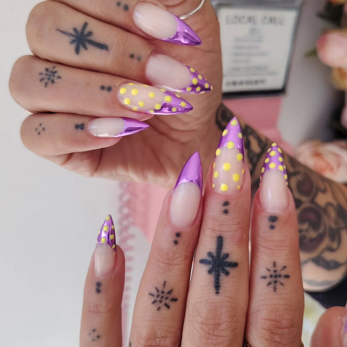 Metallic purple stiletto French tips with yellow polka dots